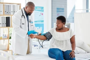 A doctor performing a health check on a patient 